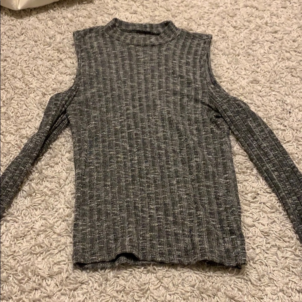 Gray sweater with holes over the shoulders